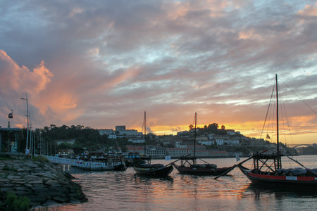 the beauty of sunset with boats in Douro river, Porto, Portugalの写真素材