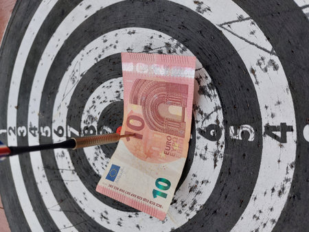 Ten euros in the center of the dartboard, a metaphor for hitting financial goals with precision