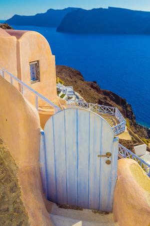 Beautiful gate in Oia village, caldera view, Santorini island, Greeceの写真素材