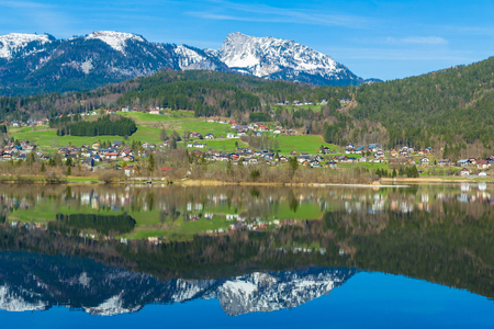 Beautiful reflection of mountain village in Hallstatter See, Austria, Europeの写真素材