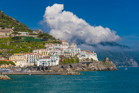 Beautiful town of Amalfi,front view with sea and boats in foreground, Amalfi coast, Campania, Italyの写真素材