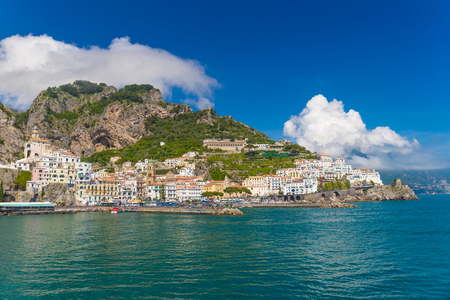 Beautiful town of Amalfi,front view with sea and boats in foreground, Amalfi coast, Campania, Italyの写真素材