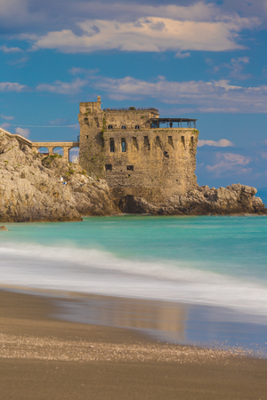 Medieval tower on the coast of Maiori town, blurred sea waves effect, Amalfi coast, Campania region, Italyのeditorial素材