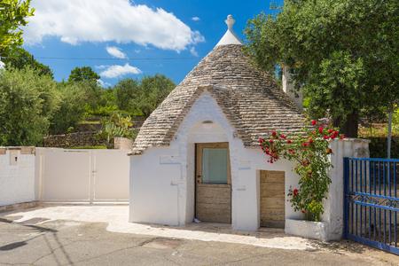 Individual inhabited trullo house with surrounding garden, Alberobello town, Apulia region, Southern Italyの写真素材