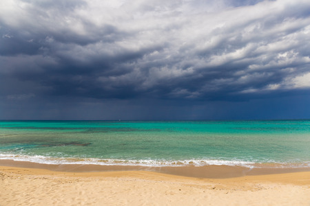 Amazing golden sand beach near Monopolli Capitolo, amazing atmosphere during stormy day, Apulia region, Southern Italyの写真素材
