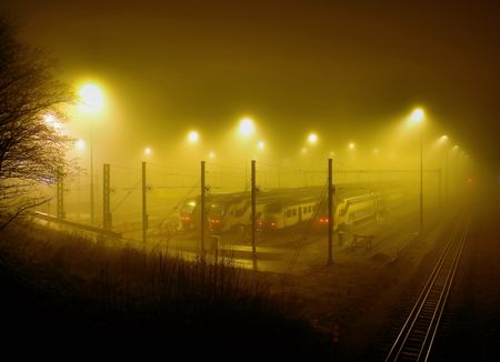 misty night at the train stationの写真素材