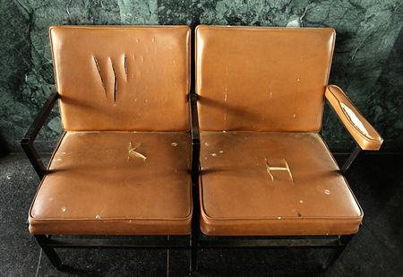Broken chairs in the waiting room of a train station in New Zealand