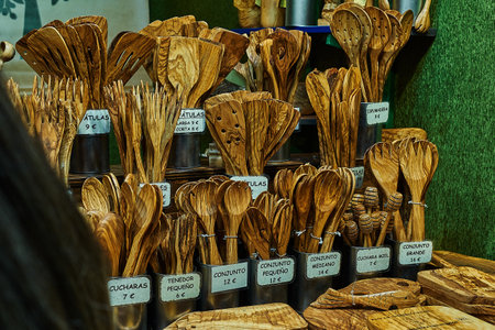 sale of forks, spoons and other handmade wooden kitchen cutlery at a fair in the bullring of Pamplonaのeditorial素材