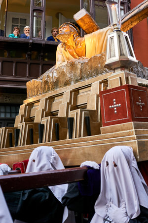 PAMPLONA, NAVARRA SPAIN APRIL 19 2019: HOLY WEEK PROCESSION THROUGH THE STREETS OF PAMPLONA