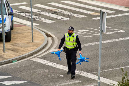SARRIGUREN, Navarra Spain MARCH 1, 2021: Police working after noticed that stones had been thrown over in Ripagainaのeditorial素材