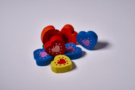 Colorful and red wooden hearts with copyspace for ornament or valentines cardの写真素材