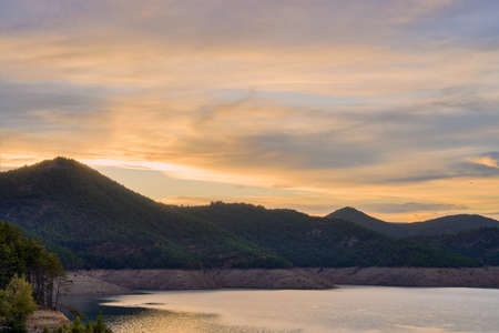 View of the Itoiz reservoir in Navarra, very empty due to the summer droughtの写真素材