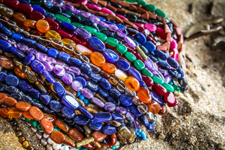 Colorful jewelry sold on the beach in southern Indiaの写真素材