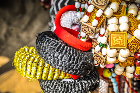 Colorful jewelry sold on the beach in southern Indiaの写真素材