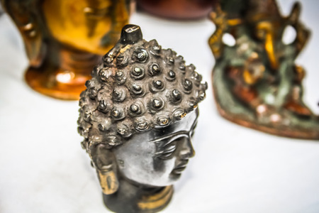 Metal gifts in a tibetan shop in southern Goaの写真素材