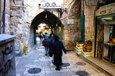 Unknown people walking in the bazaar of the Old City of Jerusalem January 1-2018 on the morningのeditorial素材