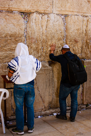 Unknown people praying on the wall of Jerusalem Israelのeditorial素材