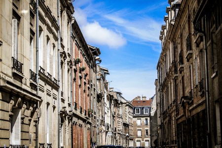 View of buildings in the street of Reims in France on the morningの写真素材