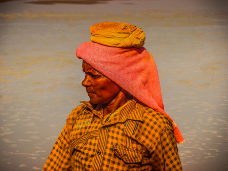 Unknowns women workers carrying stone on the head in Gokarna beach Karnataka India December 03-2017 on the morningのeditorial素材