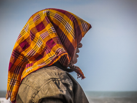 Unknowns women workers carrying stone on the head in Gokarna beach Karnataka India December 03-2017 on the morningのeditorial素材
