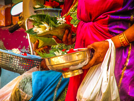 Unknowns people selling flowers on the Ganapati temple Gokarna Karnataka India November 22, 2017...