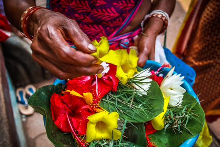 Unknowns people selling flowers on the Ganapati temple Gokarna Karnataka India November 22, 2017 morningのeditorial素材