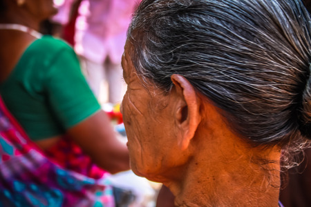 Unknowns people selling flowers on the Ganapati temple Gokarna Karnataka India November 22, 2017 morningのeditorial素材