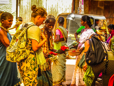 Unknowns people selling flowers on the Ganapati temple Gokarna Karnataka India November 22, 2017 morningのeditorial素材