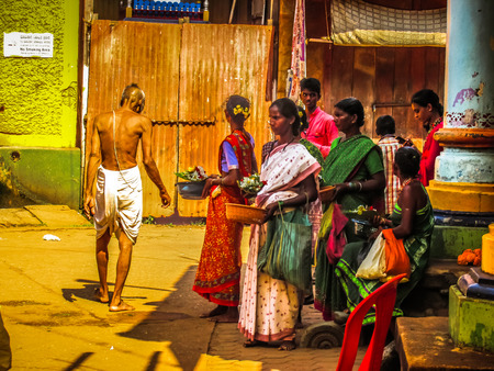 Unknowns people selling flowers on the Ganapati temple Gokarna Karnataka India November 22, 2017 morningのeditorial素材