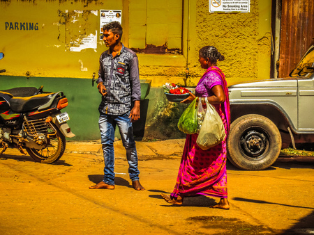 Unknowns people selling flowers on the Ganapati temple Gokarna Karnataka India November 22, 2017 morningのeditorial素材