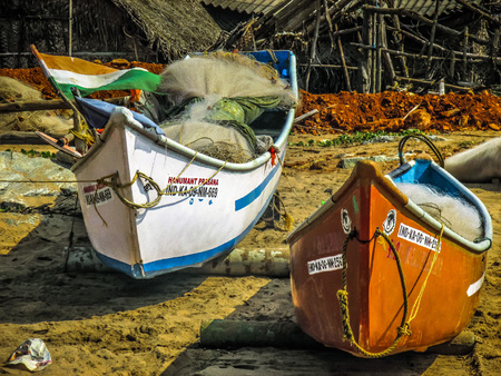 Indian fishing boat on the beach Gokarna Karnataka India December 12, 2017 morningのeditorial素材