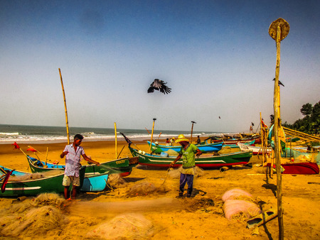 Indian fisher man on the beach Gokarna Karnataka India December 12, 2017 morningのeditorial素材