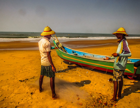 Indian fisher man on the beach Gokarna Karnataka India December 12, 2017 morningのeditorial素材