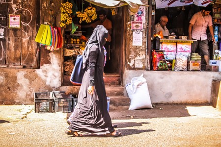 Unknown people walking on the street of Gokarna Karnataka India November 22, 2017 morningのeditorial素材