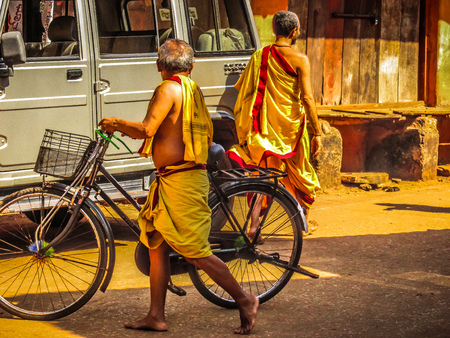 Unknown people walking on the street of Gokarna Karnataka India November 22, 2017 morningのeditorial素材