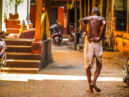 Unknown people walking on the street of Gokarna Karnataka India November 22, 2017 morningのeditorial素材