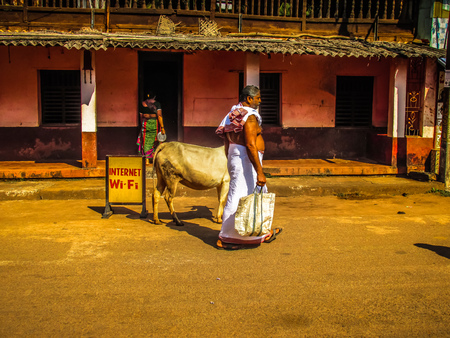 Unknown people walking on the street of Gokarna Karnataka India November 22, 2017 morningのeditorial素材