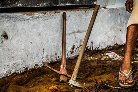 Unknown worker building a street sidewalk in Palolem Goa India October 28-2017 morningの写真素材