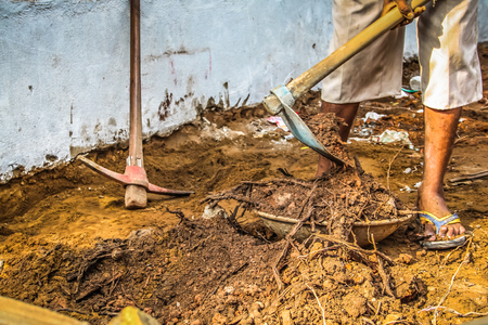 Unknown worker building a street sidewalk in Palolem Goa India October 28-2017 morningのeditorial素材