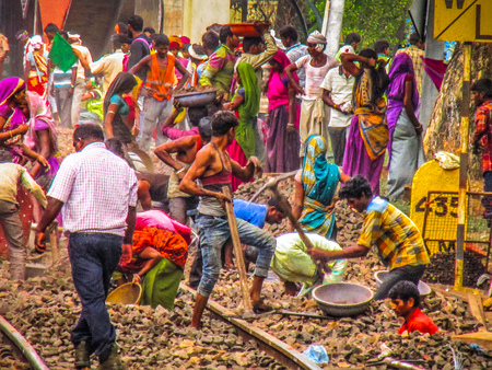 View of unknowns railway workers at Madgaon train station Goa India December 21, 2017 morningのeditorial素材