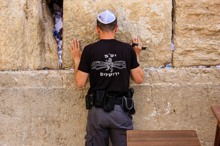 Unknown people praying at the western wall Jerusalem Israel March 23, 2018 morningのeditorial素材