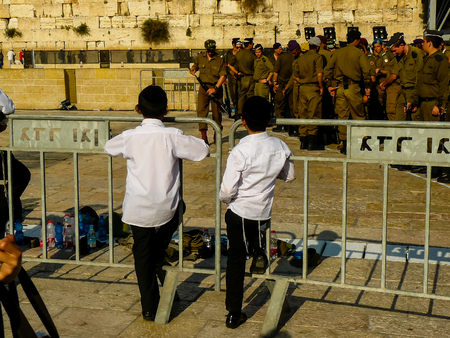 Jerusalem Israel April 16, 2018 Young kid looking a military ceremony on the Western Wall place in Jerusalem on afternoonのeditorial素材