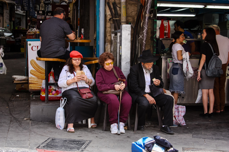 Jerusalem Israel May 02, 2018 Unknowns people sitting at the Mahane Yehuda Market in Jerusalem on the morningのeditorial素材