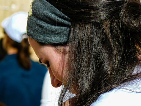 Jerusalem Israel May 14, 2018 Unknowns women praying front the Western wall in the old city of Jerusalem in the eveningのeditorial素材