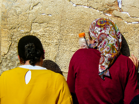 Jerusalem Israel May 14, 2018 Unknowns women praying front the Western wall in the old city of Jerusalem in the eveningのeditorial素材