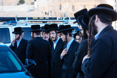 Jerusalem Israel May 14, 2018 unknown religious people accompanying the Chief Rabbi got his car from the Western Wall Square in Jerusalem in the late afternoonのeditorial素材