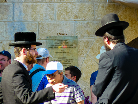 Jerusalem Israel May 14, 2018 unknown religious people in front of the public fountain on the...