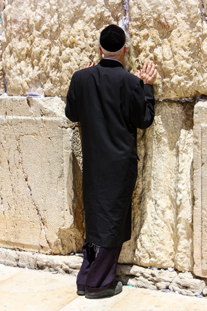 Jerusalem Israel May 21, 2018 View of an unknown religious Orthodox Jew praying in front of the western wall of the old city of Jerusalemのeditorial素材