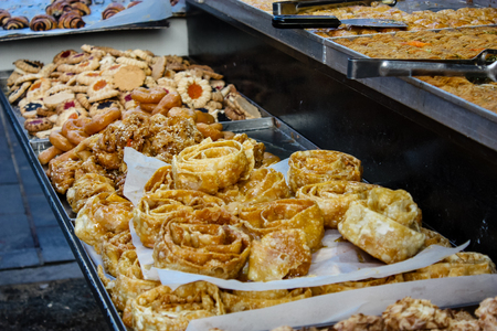 Jerusalem Israel May 24, 2018 Closeup of various pastries sold in the market of Jerusalem in Israel in the eveningのeditorial素材