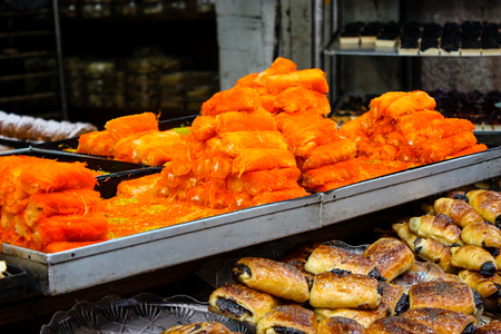 Jerusalem Israel May 24, 2018 Closeup of various pastries sold in the market of Jerusalem in Israel in the eveningのeditorial素材